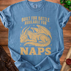 Blue t-shirt with gold text "BUILT FOR BATTLE AVAILABLE FOR NAPS" and a dragon graphic.