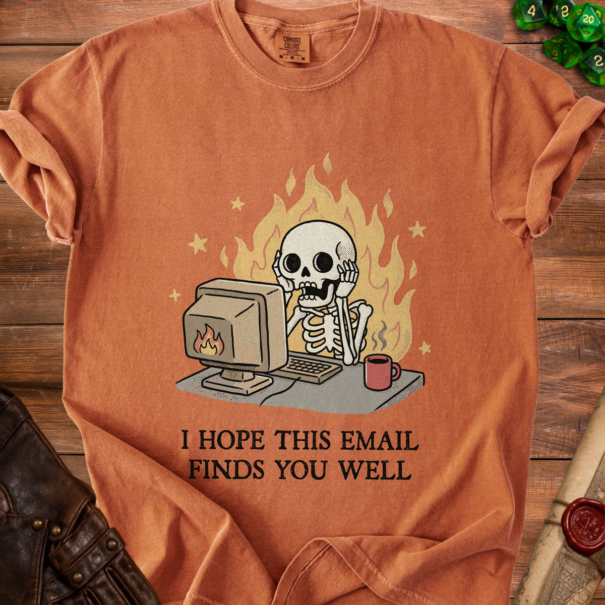 Skeleton at computer with flames and coffee. "I hope this email finds you well."