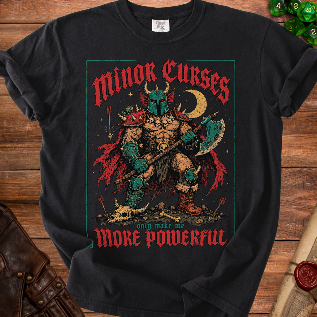 Black t-shirt with a fantasy warrior graphic and "Minor Curses Only Make Me More Powerful" text.