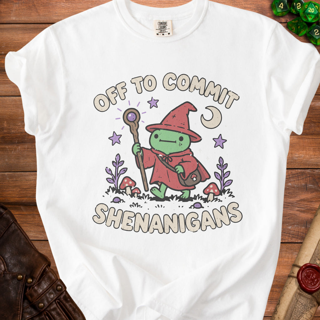 White t-shirt with a green frog wizard graphic that says "OFF TO COMMIT SHENANIGANS".