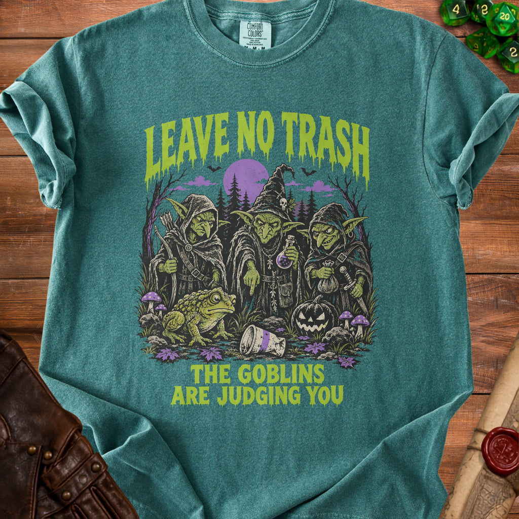 T-shirt with goblins, frog, pumpkin, and text "LEAVE NO TRASH, THE GOBLINS ARE JUDGING YOU".