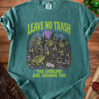 T-shirt with goblins, frog, pumpkin, and text "LEAVE NO TRASH, THE GOBLINS ARE JUDGING YOU".