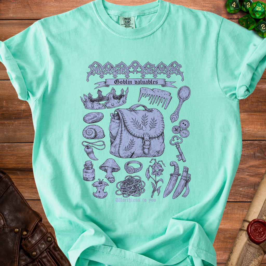 Teal t-shirt with "Goblin valuables" and various sketched items.