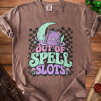 Brown t-shirt with "OUT OF SPELL SLOTS" text and fantasy graphics.