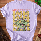 Lilac t-shirt with distressed graphic of a stressed-out green monster and repeating "AAAAA".