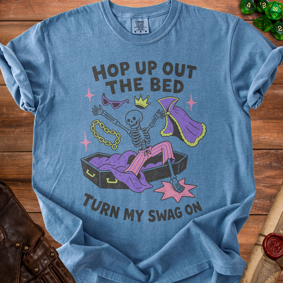 Skeleton emerging from coffin with text "Hop up out the bed turn my swag on."