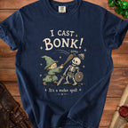 T-shirt graphic of a wizard casting a melee spell on a skeleton.