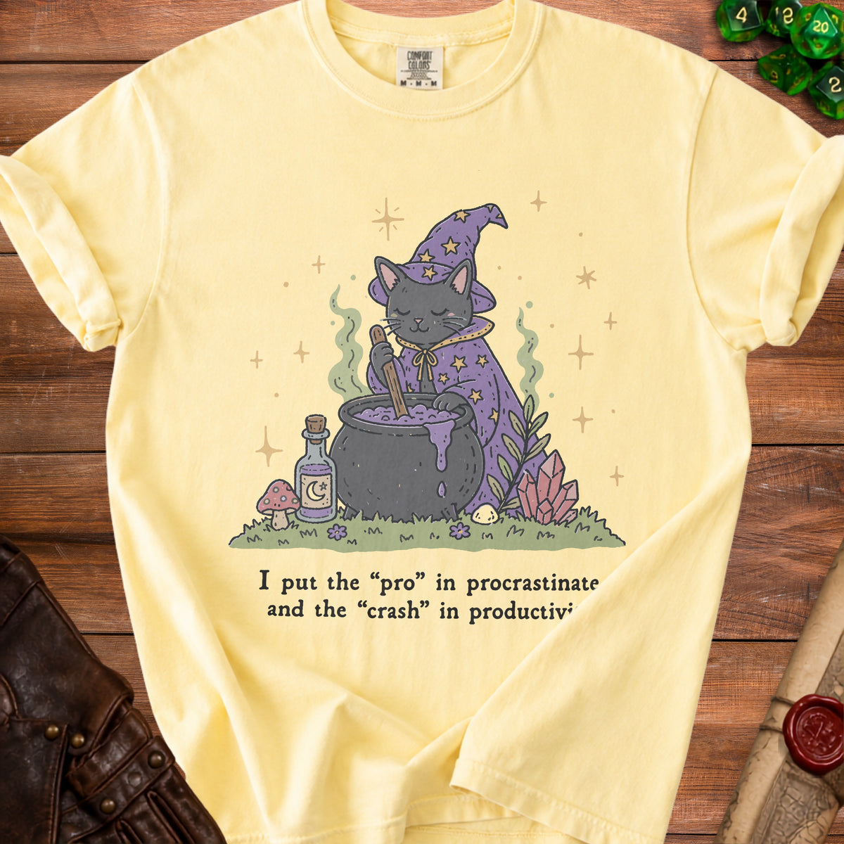 Yellow t-shirt with a graphic of a cat witch and text about procrastination and productivity.