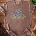 Knight in armor resting with a cup of tea and text "Even the bravest knight needs a little lie down."