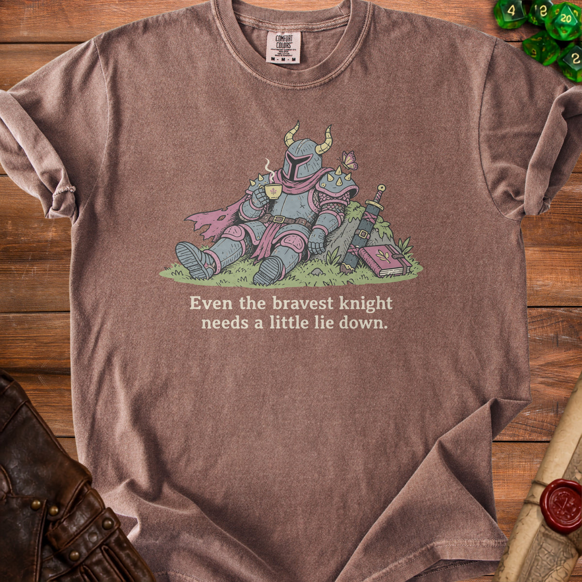 Knight in armor resting with a cup of tea and text "Even the bravest knight needs a little lie down."