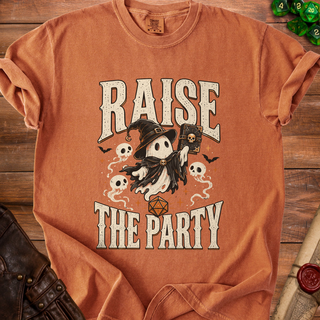 Orange t-shirt with a ghost in a witch hat holding a book, text "RAISE THE PARTY".
