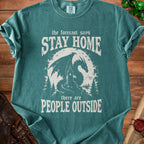 Green t-shirt with dragon, lighthouse, and text "The forecast says Stay Home, there are People Outside."
