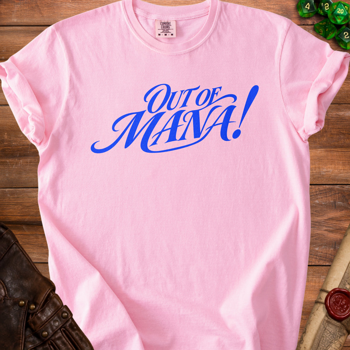Pink t-shirt with blue "Out of Mana!" text and a roll of parchment.