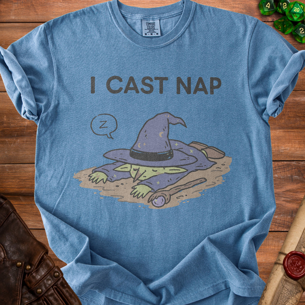 Blue t-shirt with text "I CAST NAP" and sleeping wizard graphic.