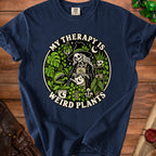 Navy t-shirt with a skeleton wearing a witch hat watering plants, text "My Therapy is Weird Plants".