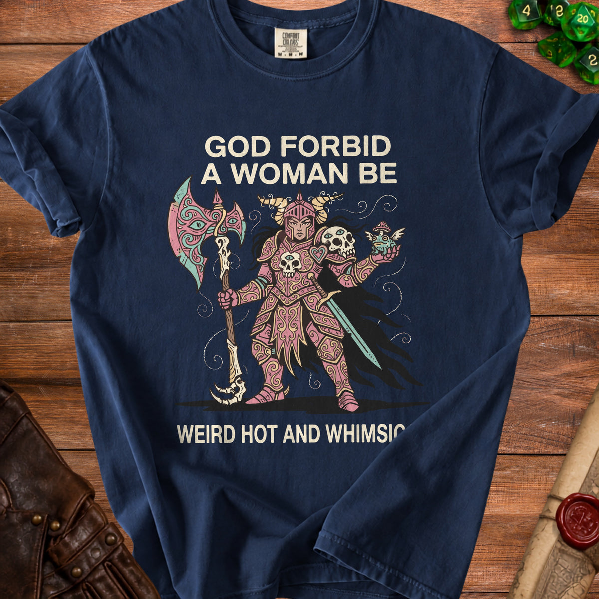 Navy t-shirt with "GOD FORBID A WOMAN BE WEIRD HOT AND WHIMSIC" text and warrior graphic.