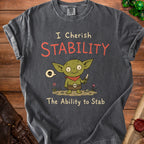 Grey t-shirt with a cartoon goblin holding a knife and text reading "I Cherish Stability The Ability to Stab".