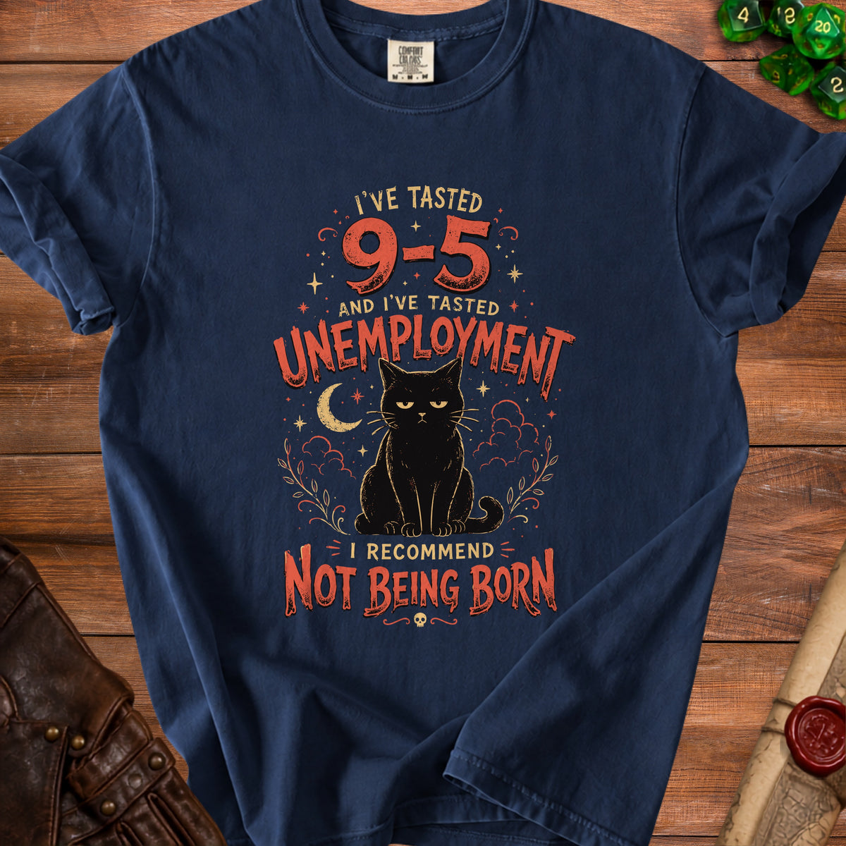 Navy t-shirt with a black cat and text: "I've tasted 9-5 and I've tasted unemployment. I recommend not being born."