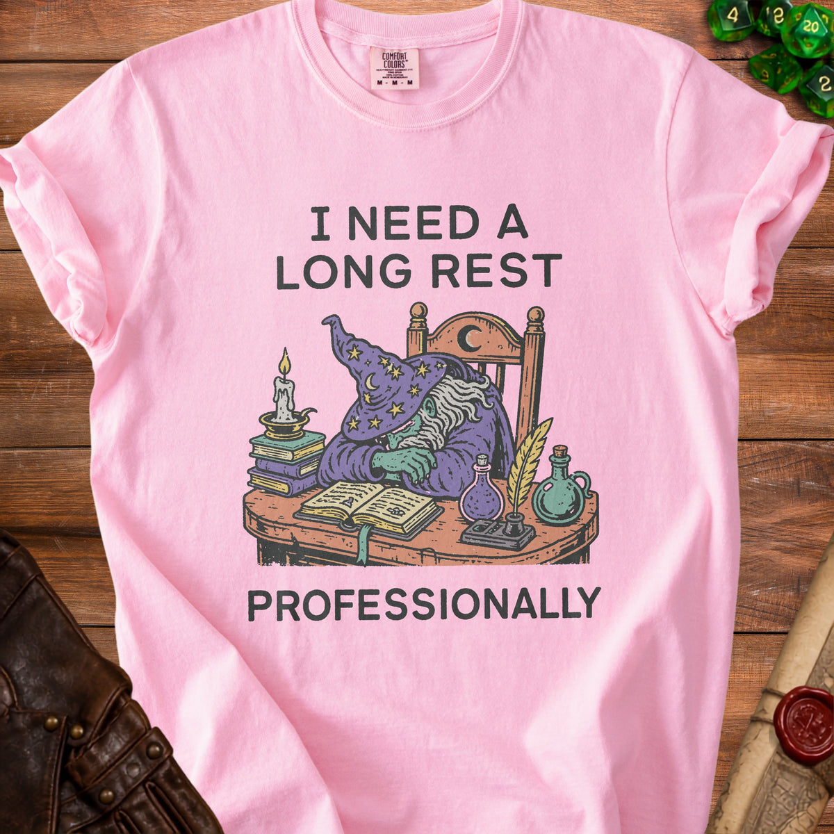 Pink t-shirt with wizard graphic and text "I NEED A LONG REST PROFESSIONALLY".