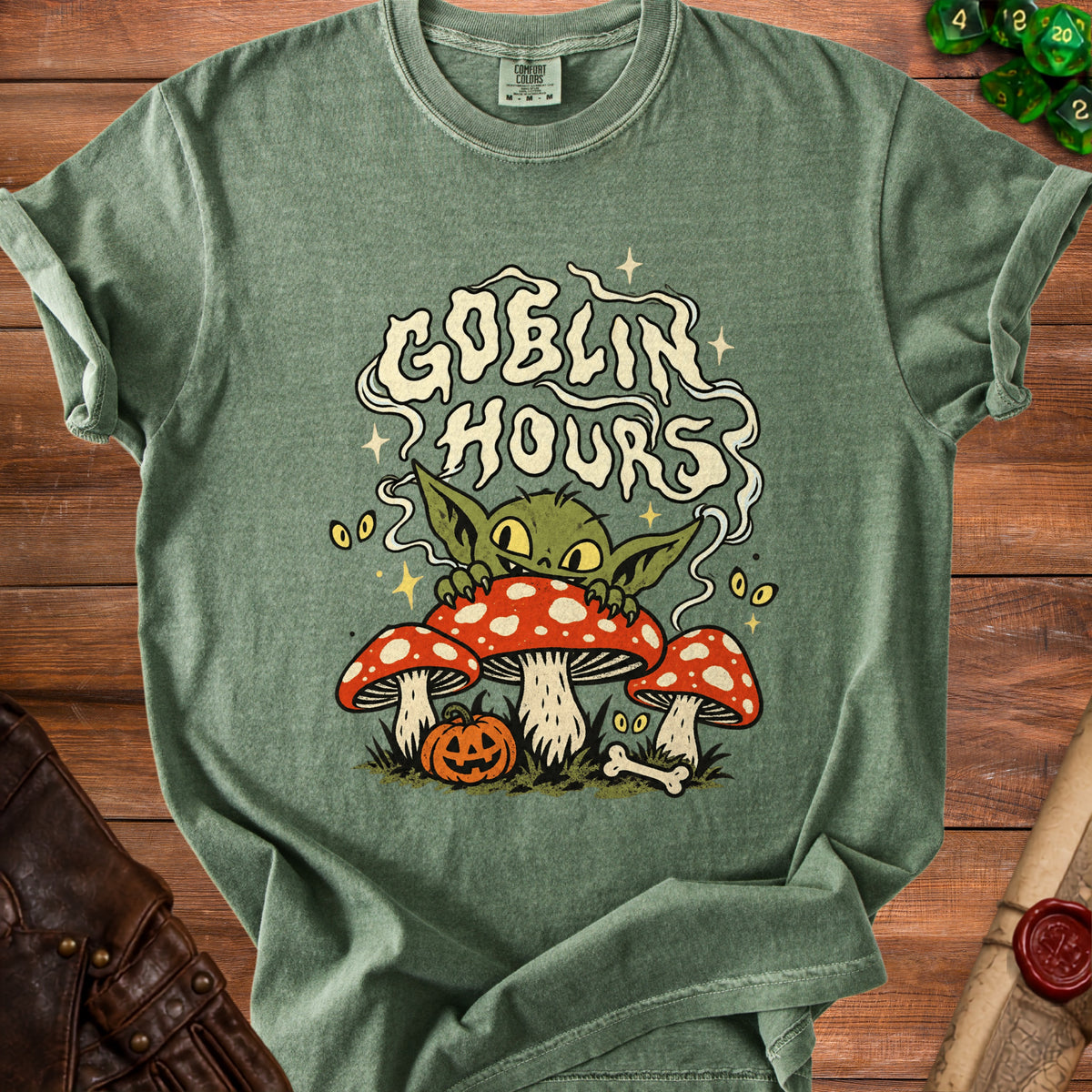 Green t-shirt with "Goblin Hours" text, a goblin, mushrooms, and a pumpkin.