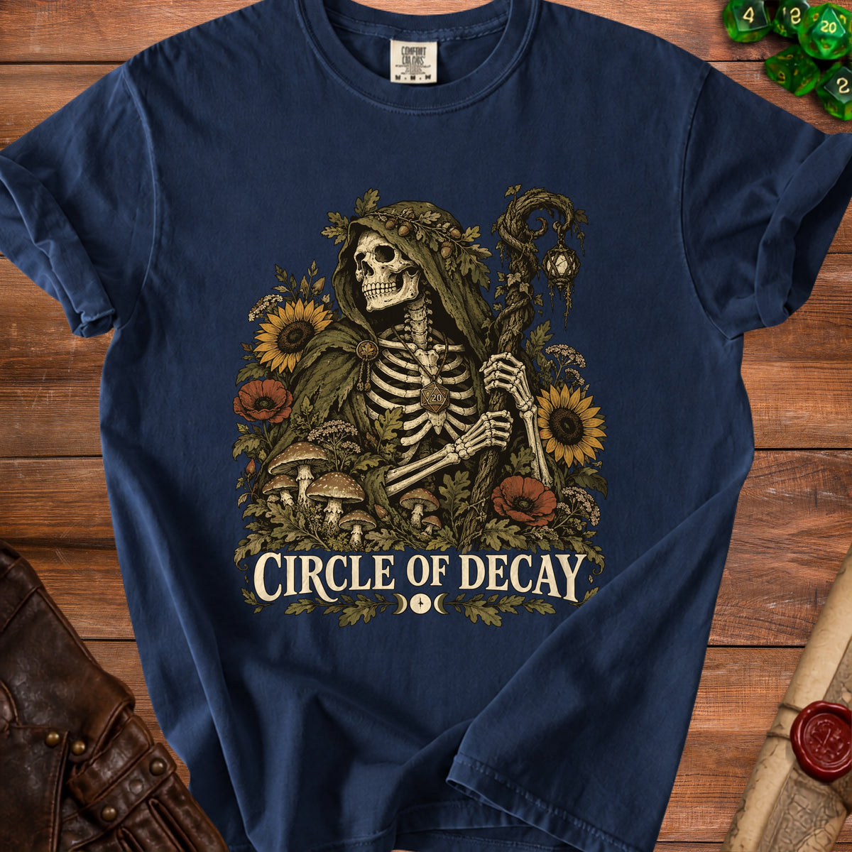 Navy t-shirt with skeleton, sunflowers, poppies, mushrooms, and "CIRCLE OF DECAY" text.
