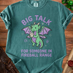 Green t-shirt with purple text and a cartoon dragon holding fire.