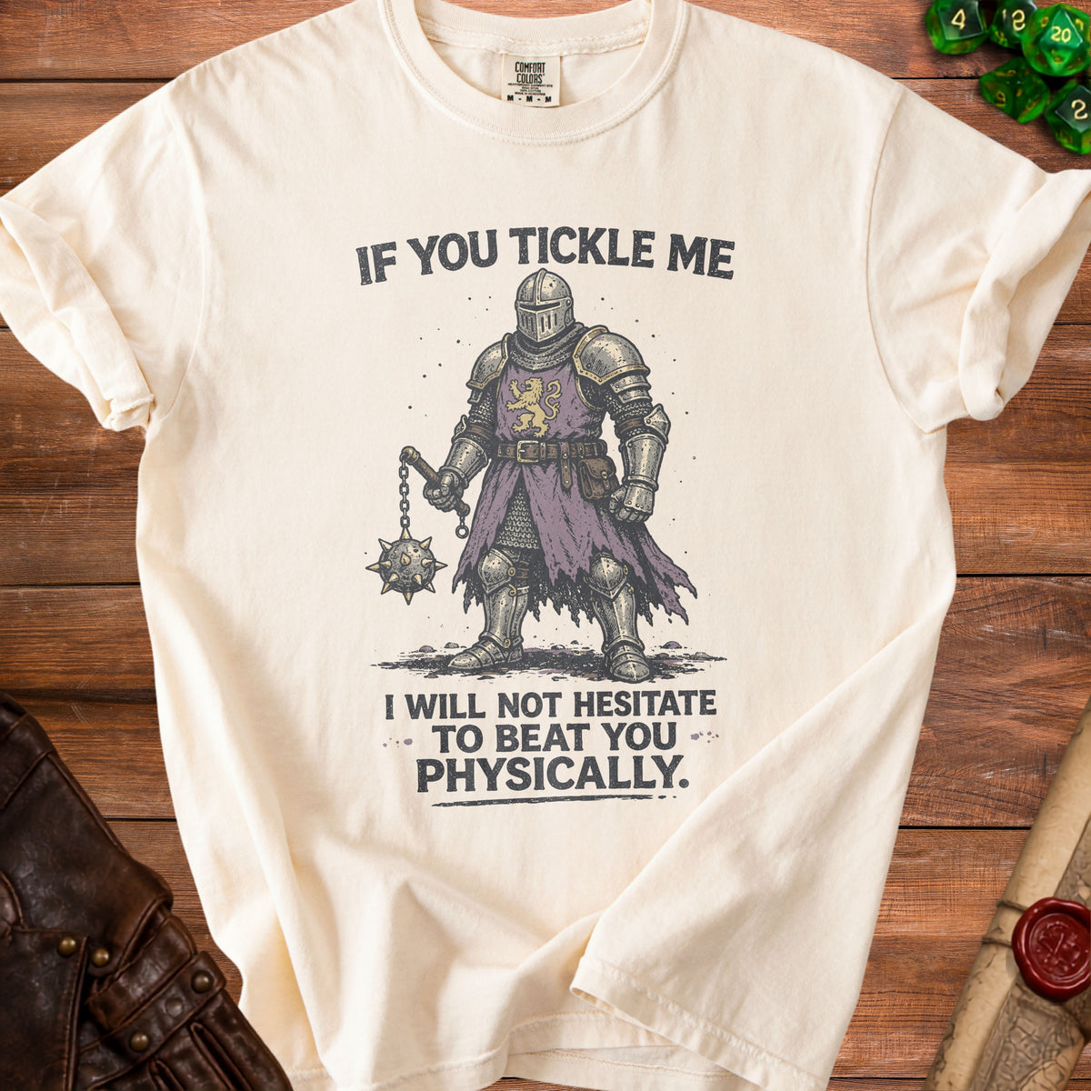Cream t-shirt with knight graphic and text "If You Tickle Me I Will Not Hesitate To Beat You Physically."