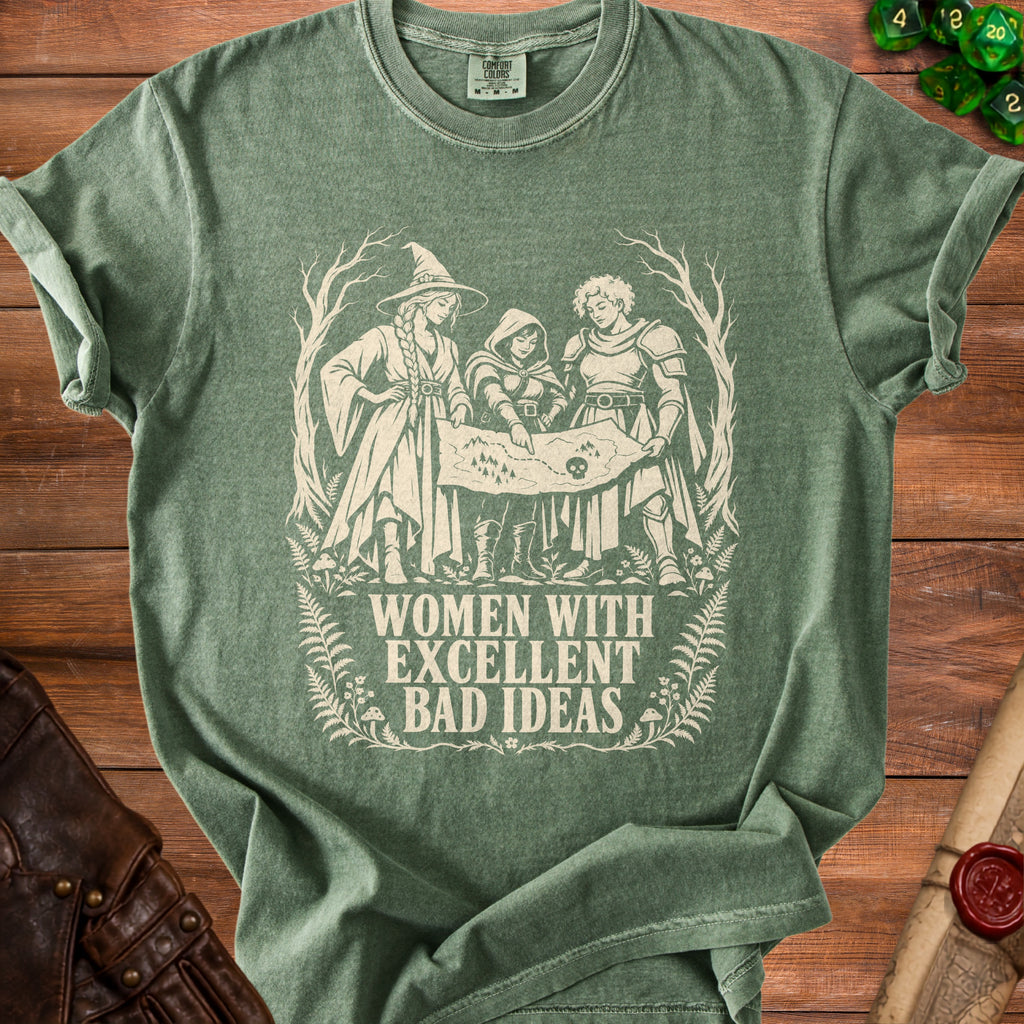 Green t-shirt graphic of three women planning with a map: "Women With Excellent Bad Ideas".