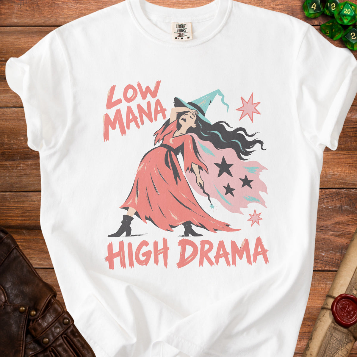 White t-shirt with "Low Mana High Drama" text and a distressed witch graphic.