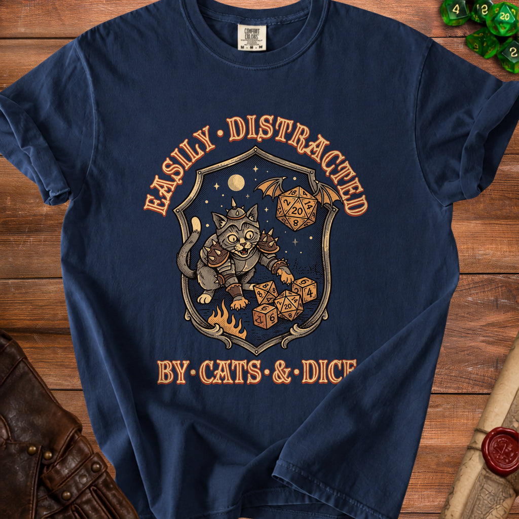 Dark blue t-shirt with a shield graphic of a cat in armor surrounded by dice.
