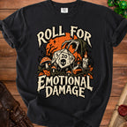 Black t-shirt with "Roll for Emotional Damage" text, a d20 die, skull, mushrooms, and candle.