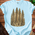 Light blue t-shirt with artwork of two fantasy figures in a redwood forest.