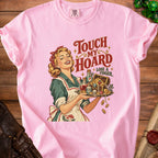 Pink t-shirt with retro art of a woman holding a tray of treasure, text "Touch My Hoard Lose A Finger".