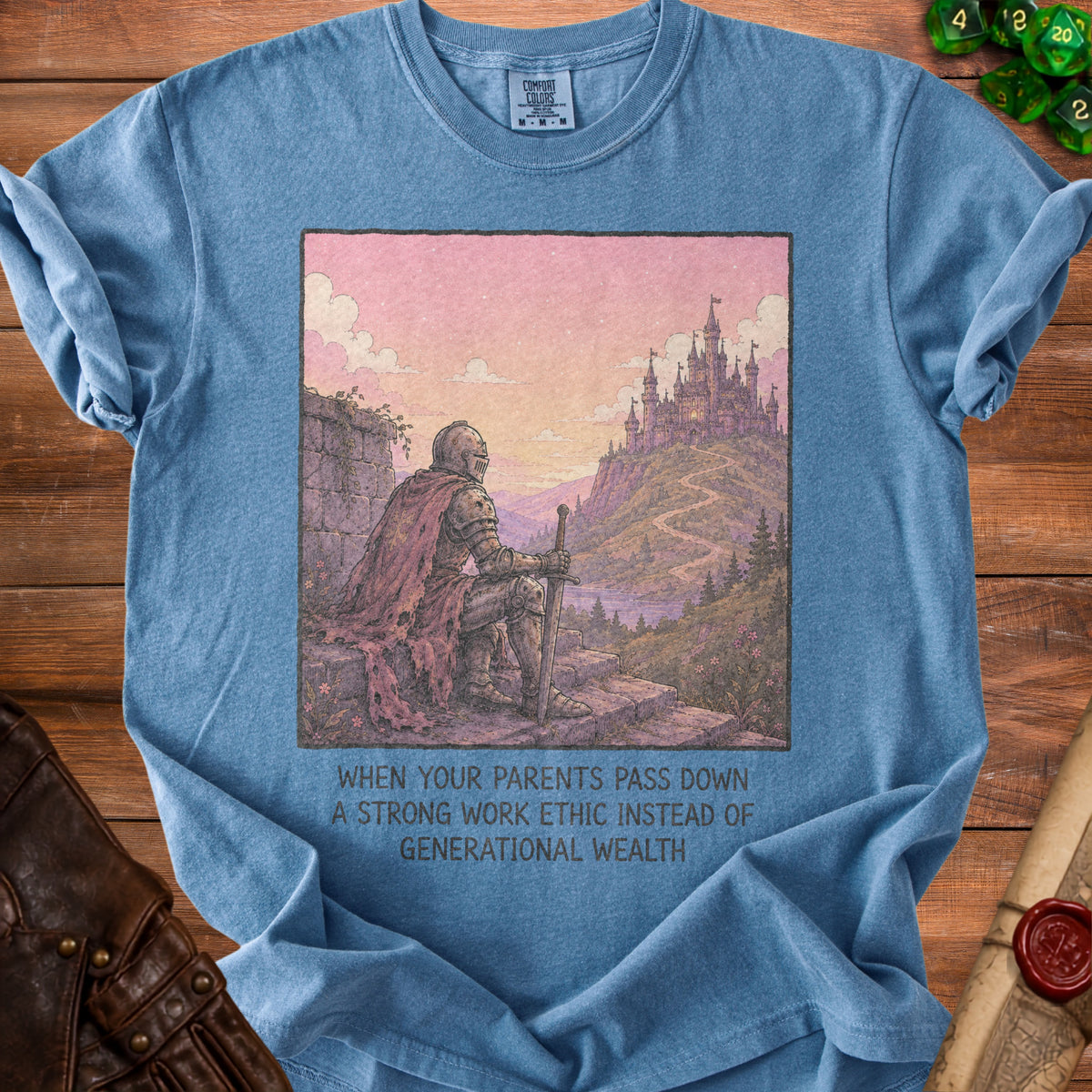 Blue t-shirt with knight overlooking a castle and text "when your parents pass down a strong work ethic instead of generational wealth."
