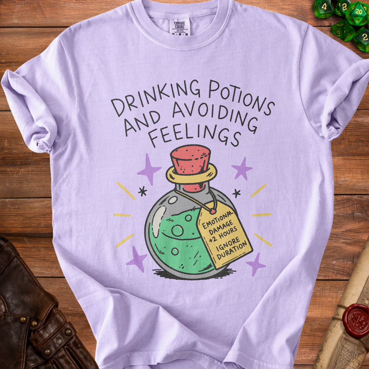 Lilac t-shirt with "Drinking Potions and Avoiding Feelings" text and potion graphic.