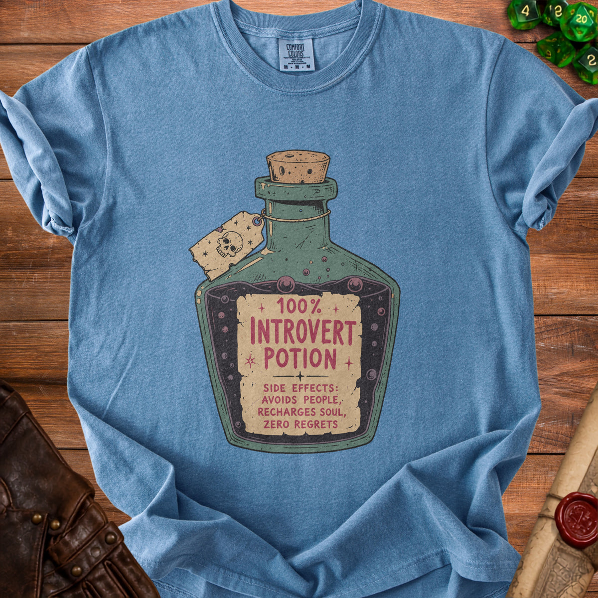 Blue t-shirt with "100% Introvert Potion" and side effects printed on a bottle graphic.
