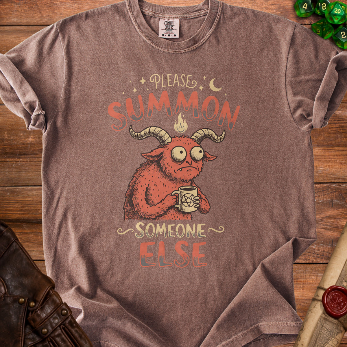 T-shirt with a distressed illustration of a demon holding a pentagram mug, saying "Please Summon Someone Else".