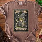 T-shirt with a tarot card design featuring a frog wizard and text "MENTAL CHECK: FAIL".