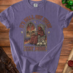 T-shirt with illustration of devil on throne and text "IT'S HELL OUT THERE STAY INSIDE".