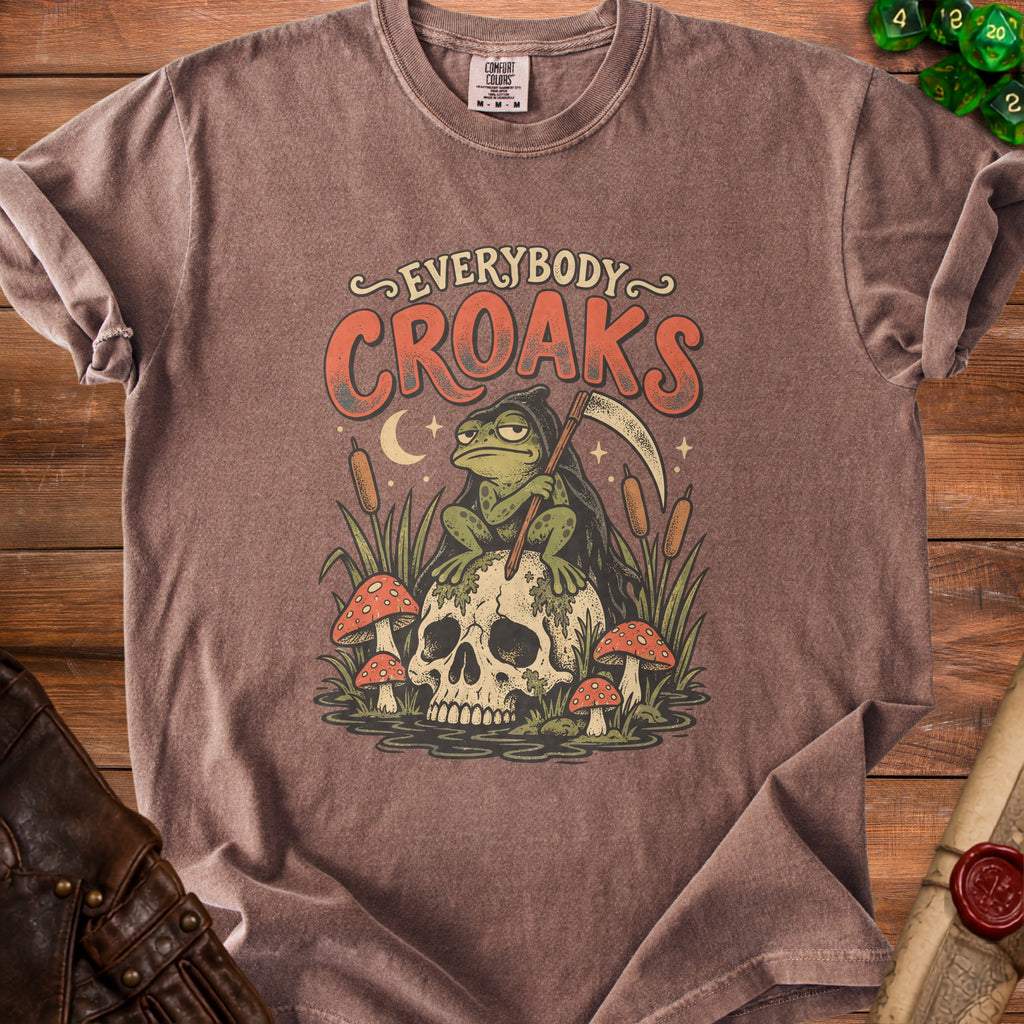 Brown t-shirt with Grim Reaper frog illustration and "Everybody Croaks" text.