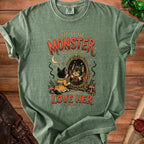 Green t-shirt with a cat looking in a mirror and the text "I Gaze At The Monster I Have Become And I Love Her".