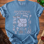 Blue t-shirt with "Goblin valuables" and various sketches of items, reading "Worthless to you".