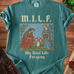 Teal t-shirt with text "M.I.L.F. My Ideal Life: Foraging" and a medieval illustration.
