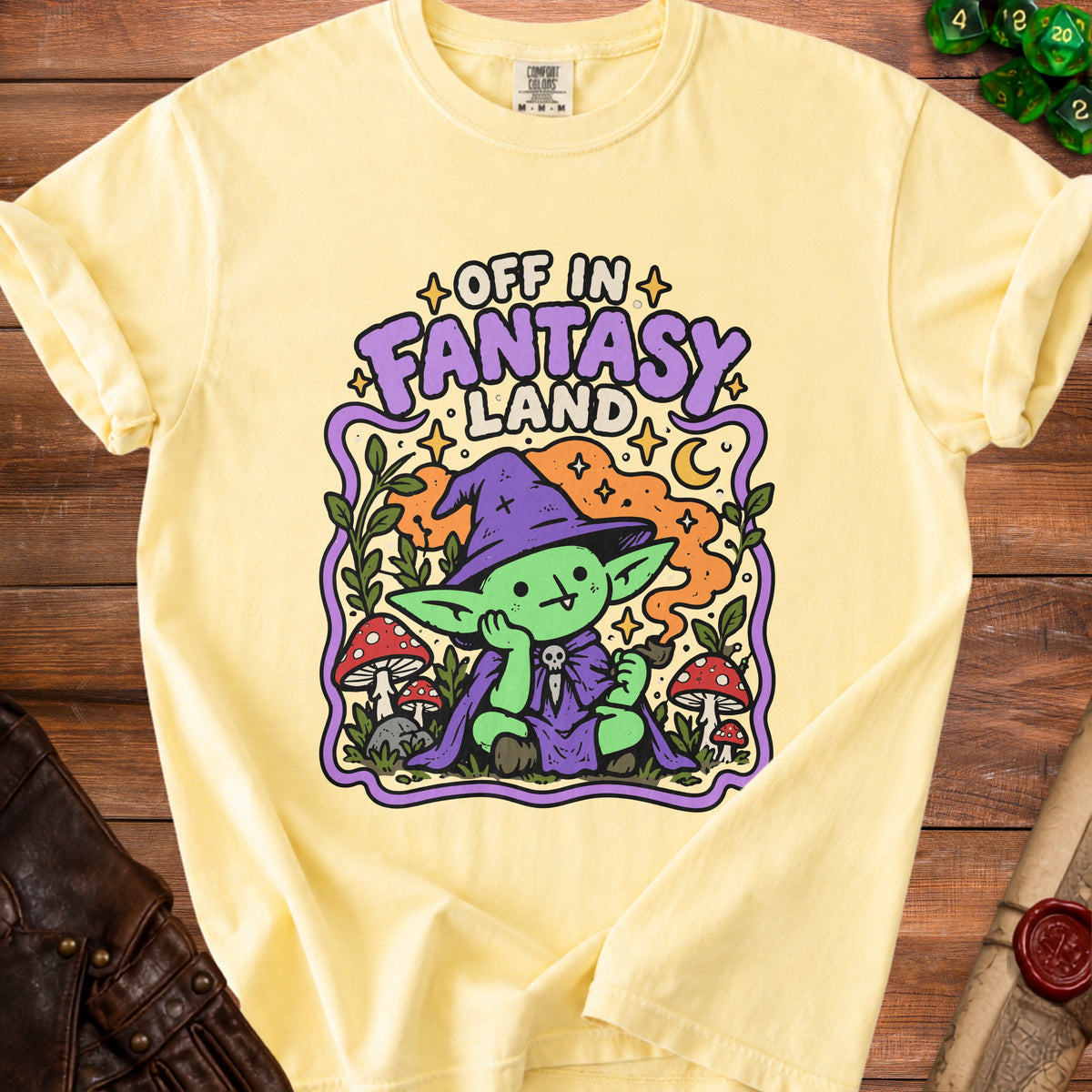 Yellow t-shirt with "Off in Fantasy Land" text and a green goblin wizard.
