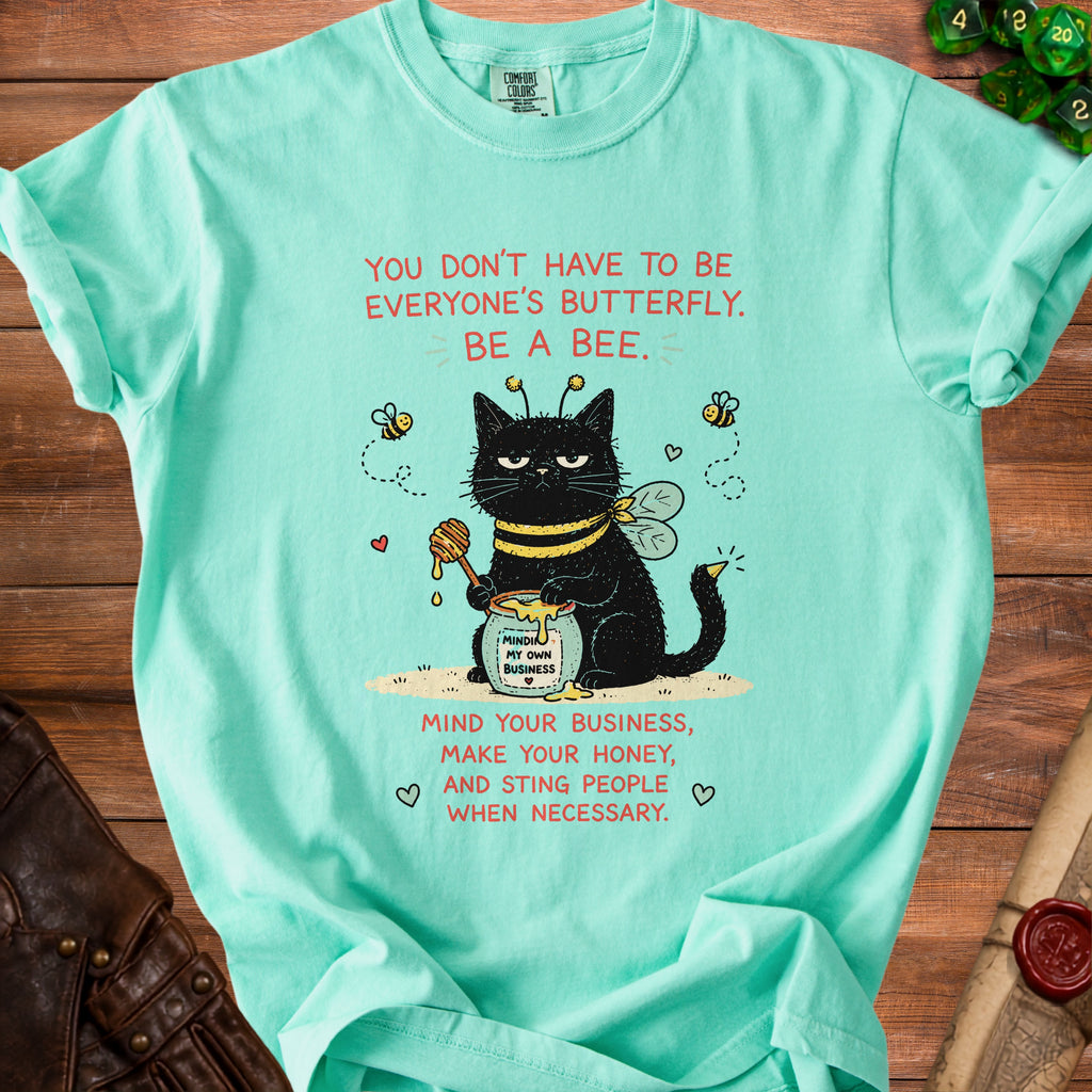 Black cat wearing bee wings and holding honey with text "Be a bee."