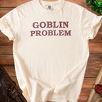Cream t-shirt with "GOBLIN PROBLEM" text in maroon.