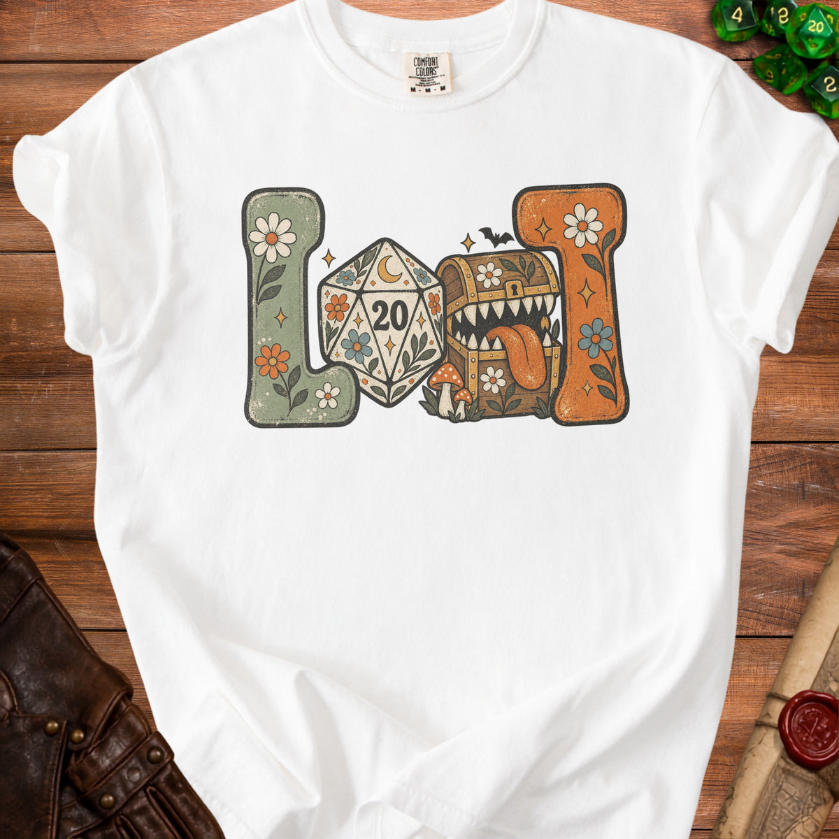 White t-shirt with retro-style dice, treasure chest, and floral design.