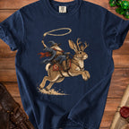 Wizard riding a jackalope with a lasso of light, on a navy blue shirt.