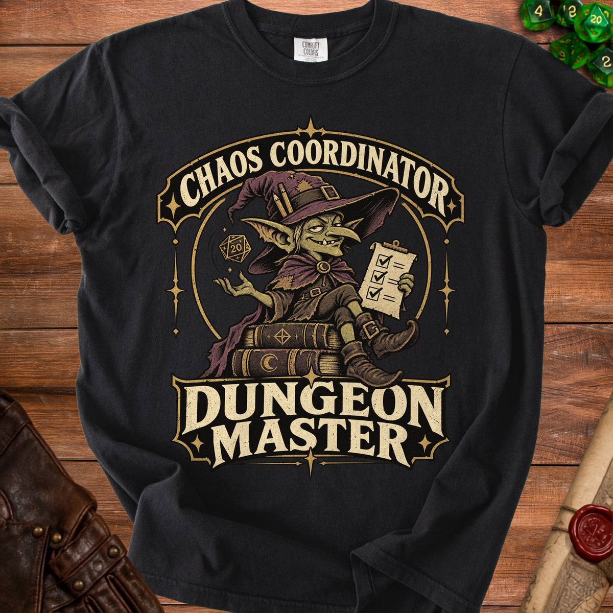 A black t-shirt featuring a green goblin wizard graphic with the text Chaos Coordinator Dungeon Master.