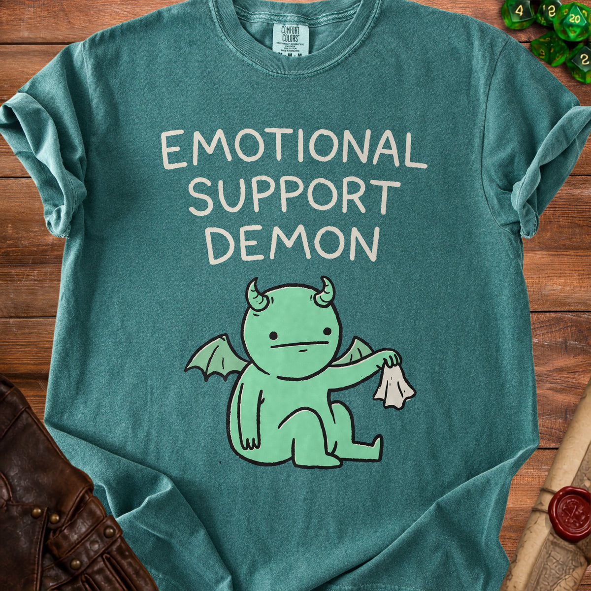 Green t-shirt with "Emotional Support Demon" text and cartoon demon graphic.